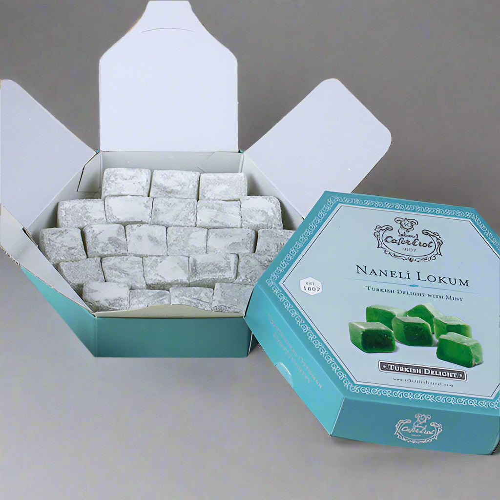 A hexagonal box of Mint Turkish Delight by Çekerci Cafer Erol, displaying the product with visible green mint-flavored candies and an open lid on a marble surface.